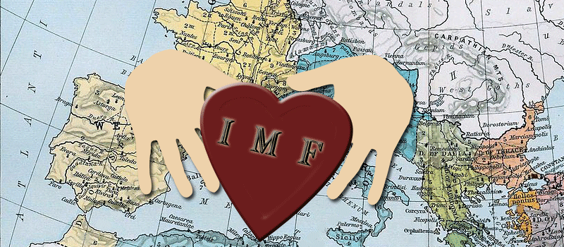 Picture of two hands holding a heart with the inticials IMF.  The world is in the backround.